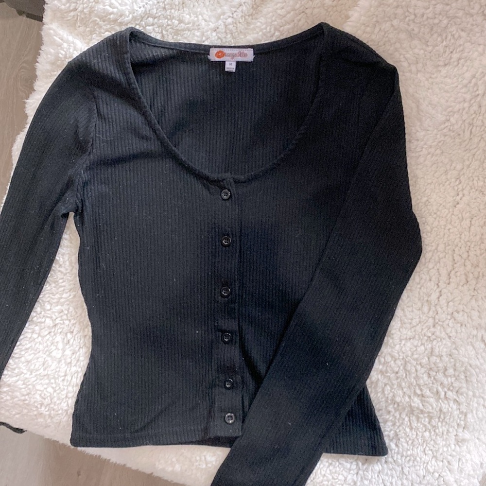 Medium black tight fitting black button up shallow crop top